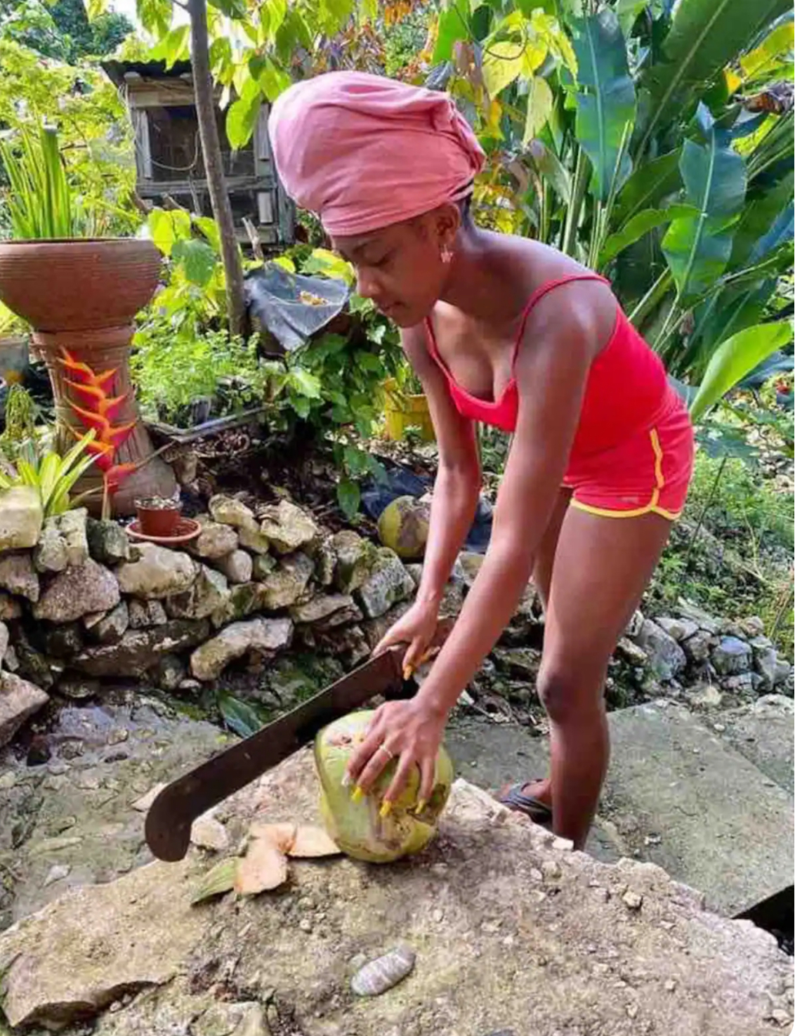 Kiara, aged 13, chopping a coconut at the retreat