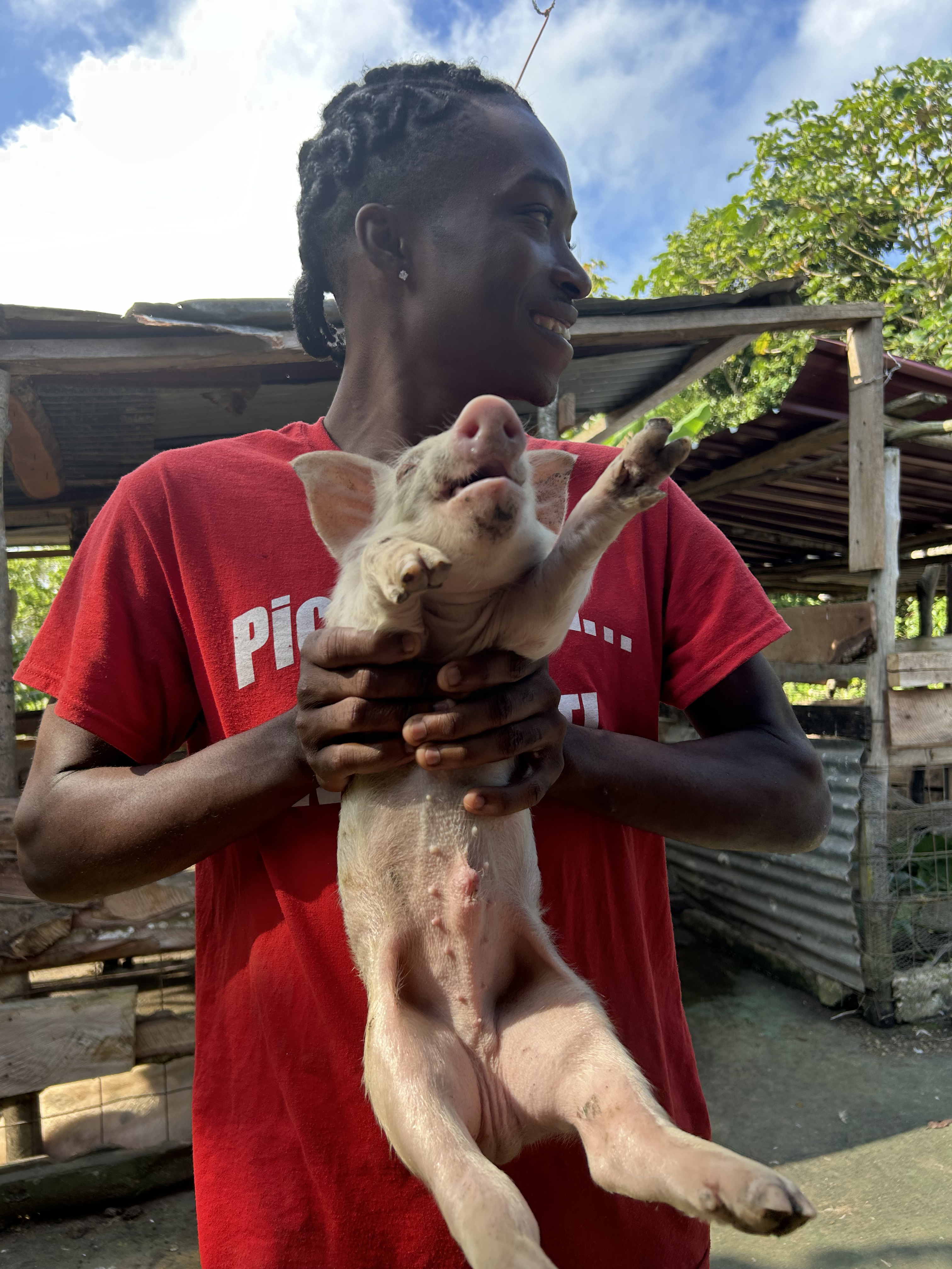 Uncle Teddy with a piglet