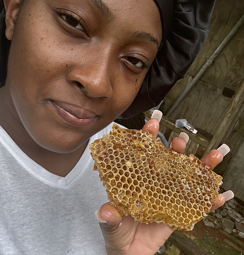 Kiara with honey from our bees